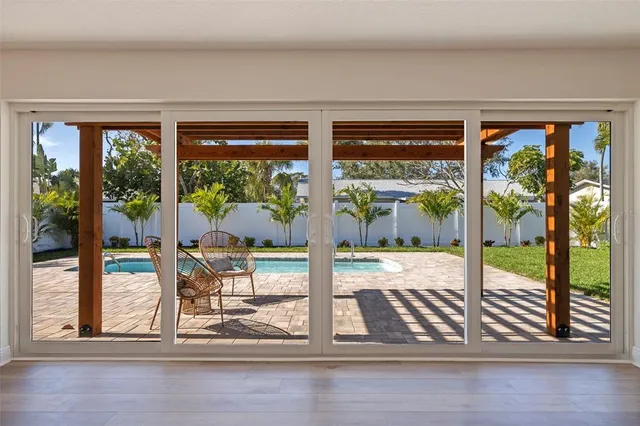 a view of a living room and floor to ceiling window