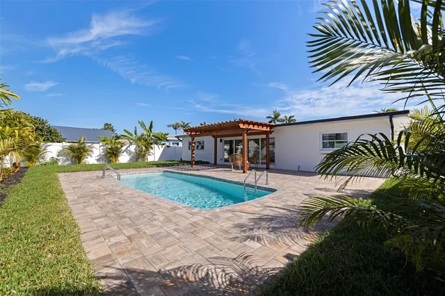 a view of a swimming pool with a patio