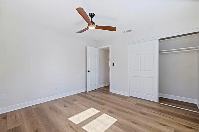 a backyard of a house with potted plants