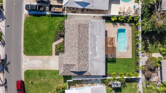 an aerial view of a house with outdoor space