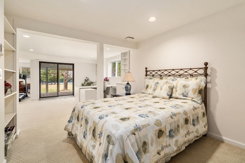 1 Pickwick Way, Unit 1 Wayland, MA 01778 - Photo 21 of 32 a spacious bedroom with a large bed and a large window
