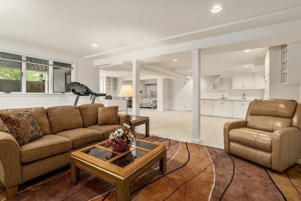 1 Pickwick Way, Unit 1 Wayland, MA 01778 - Photo 22 of 32 a living room with furniture and a large window