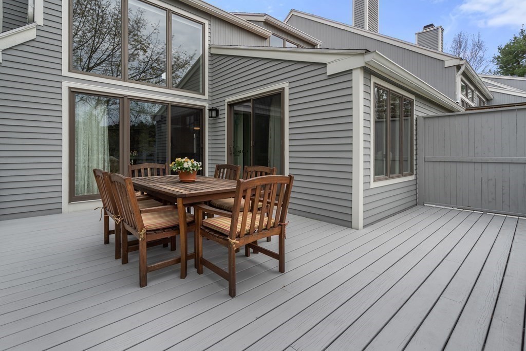 1 Pickwick Way, Unit 1 Wayland, MA 01778 - Photo 26 of 32 a dining room with furniture and wooden floor