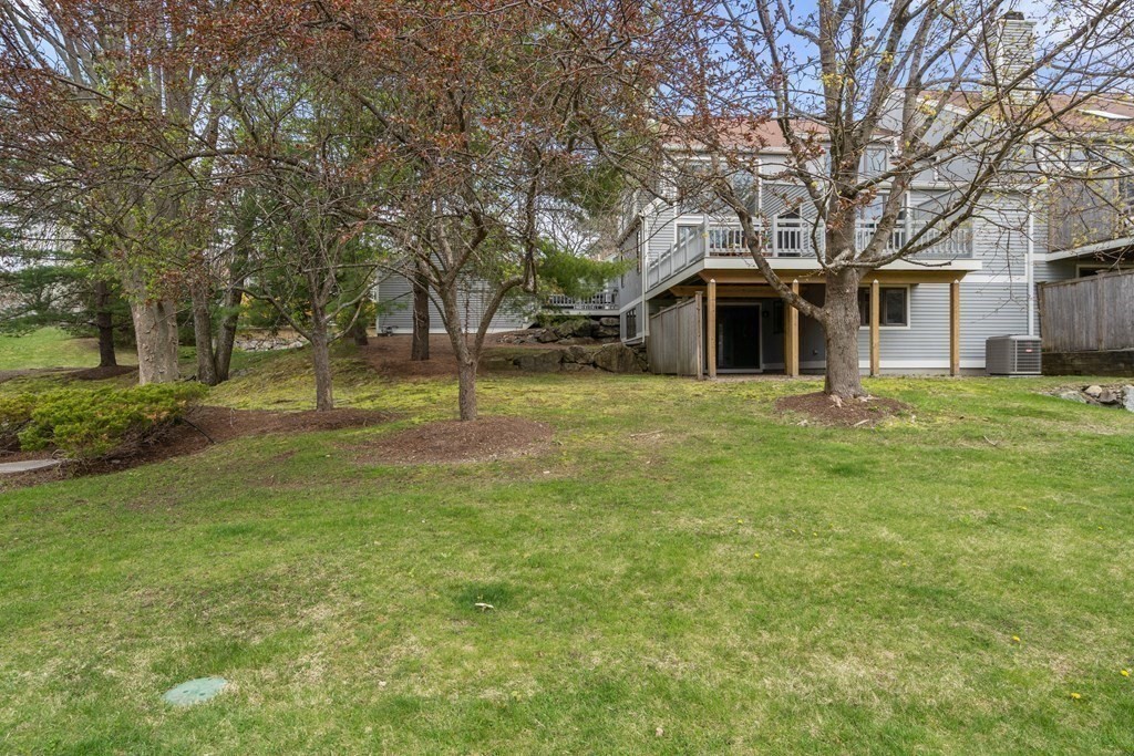 1 Pickwick Way, Unit 1 Wayland, MA 01778 - Photo 29 of 32 a front view of a house with a yard