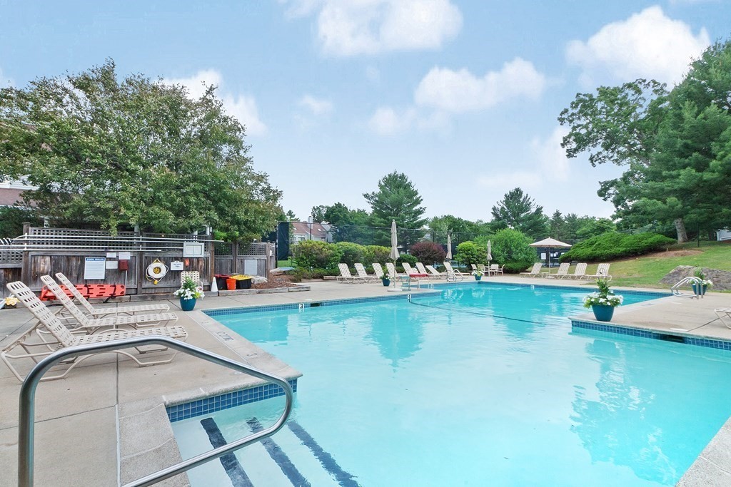 1 Pickwick Way, Unit 1 Wayland, MA 01778 - Photo 31 of 32 a view of a swimming pool with a lounge chairs