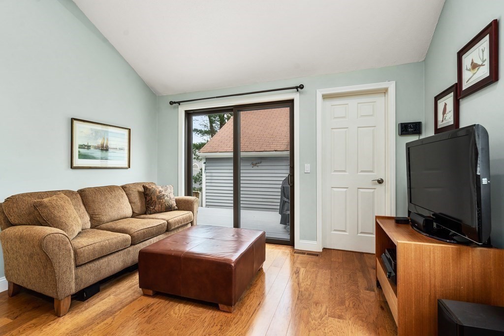 1 Pickwick Way, Unit 1 Wayland, MA 01778 - Photo 8 of 32 a living room with furniture and a flat screen tv