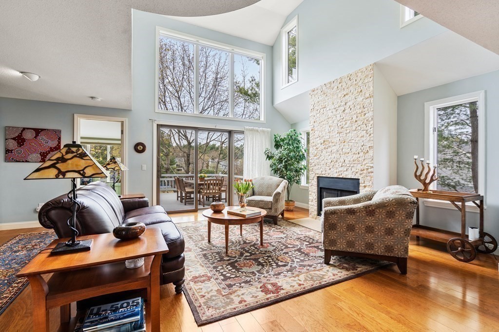 1 Pickwick Way, Unit 1 Wayland, MA 01778 - Photo 9 of 32 a living room with furniture and a fireplace