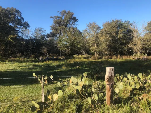 a view of a lake with a yard