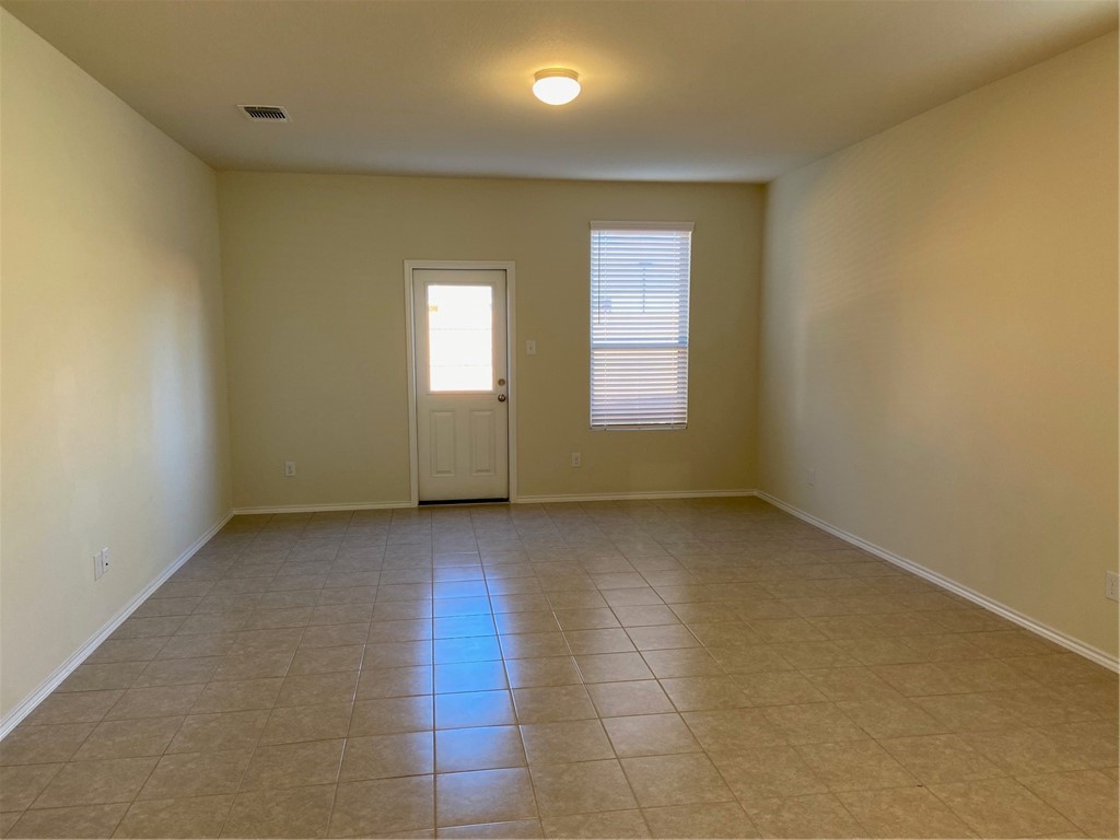 200 Kildeer Pass Jarrell, TX 76537 - Photo 11 of 27 an empty room with windows