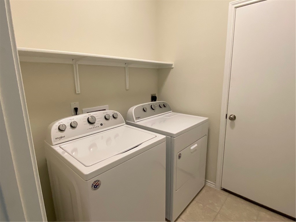 200 Kildeer Pass Jarrell, TX 76537 - Photo 22 of 27 a utility room with dryer and washer