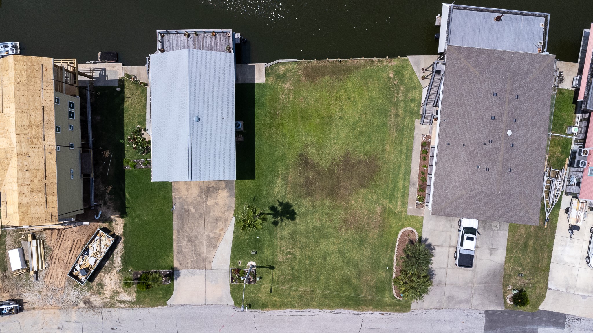 Lot 46 Bamboo Road Tiki Island, TX 77554 - Photo 12 of 23 an aerial view of a house with a yard and large tree