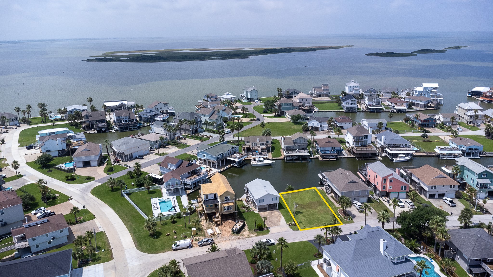 Lot 46 Bamboo Road Tiki Island, TX 77554 - Photo 15 of 23 an aerial view of ocean and houses with outdoor space
