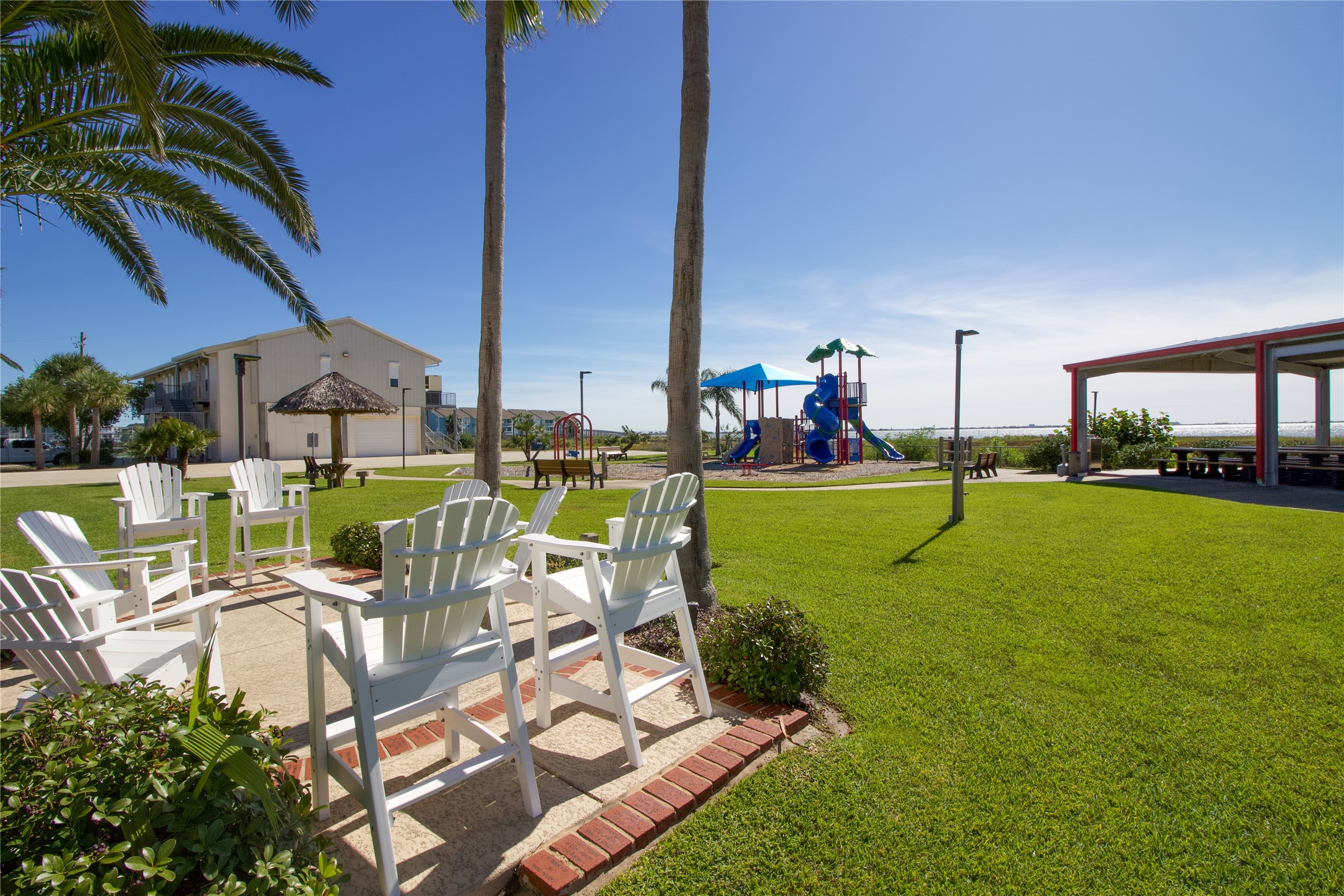 Lot 46 Bamboo Road Tiki Island, TX 77554 - Photo 22 of 23 a view of a swimming pool with lawn chairs