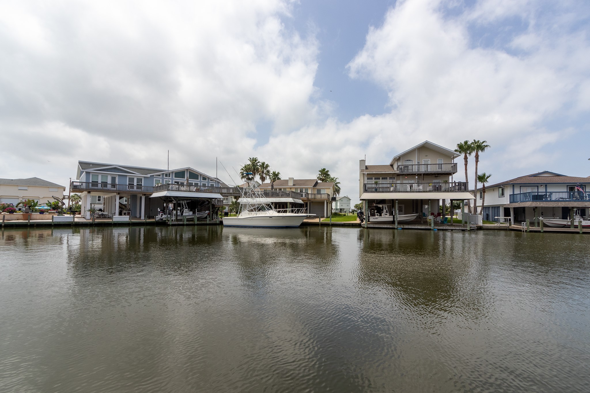 Lot 46 Bamboo Road Tiki Island, TX 77554 - Photo 4 of 23 a view of a lake with boats and trees in the background