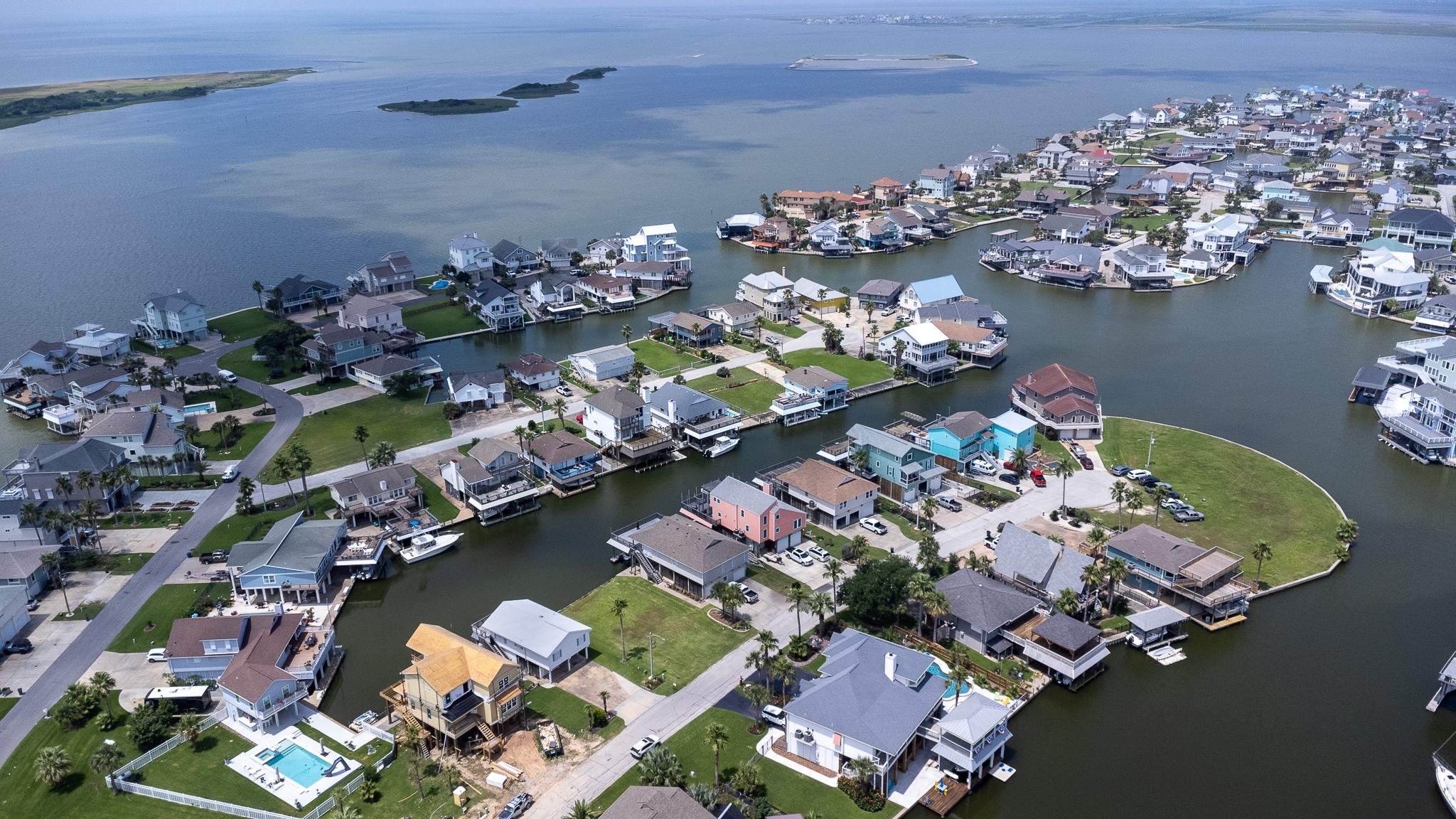 Lot 46 Bamboo Road Tiki Island, TX 77554 - Photo 7 of 23 an aerial view of a house yard swimming pool and outdoor seating