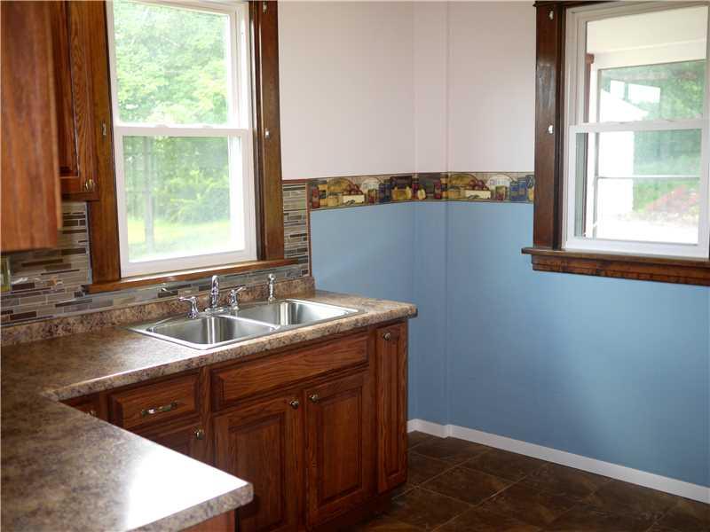 2070 Mercer Road New Brighton, PA 15066 - Photo 3 of 16 Kitchen. Freshly painted A White and Sweet Country Blue with a charming border Space to right of sink is for the refridgerator.