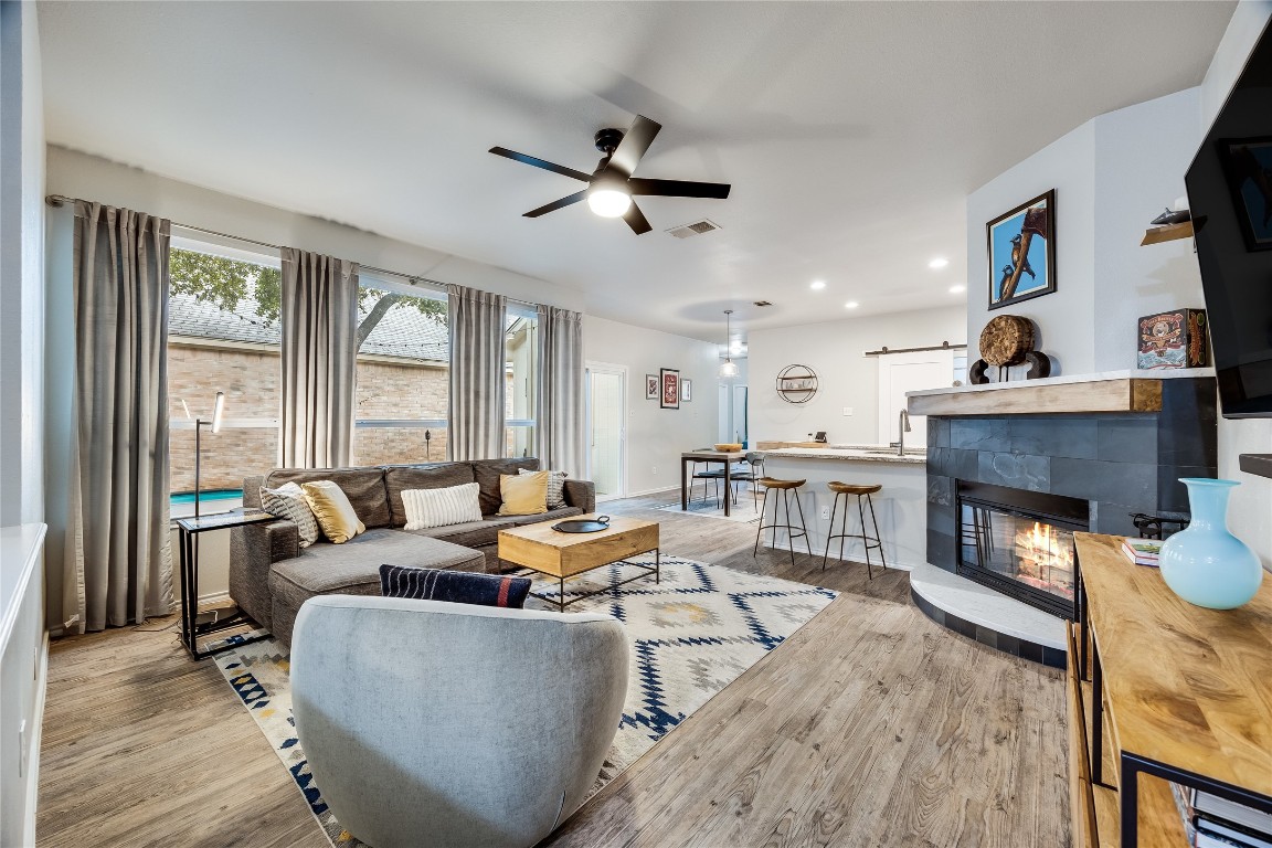 a living room with furniture and a fireplace