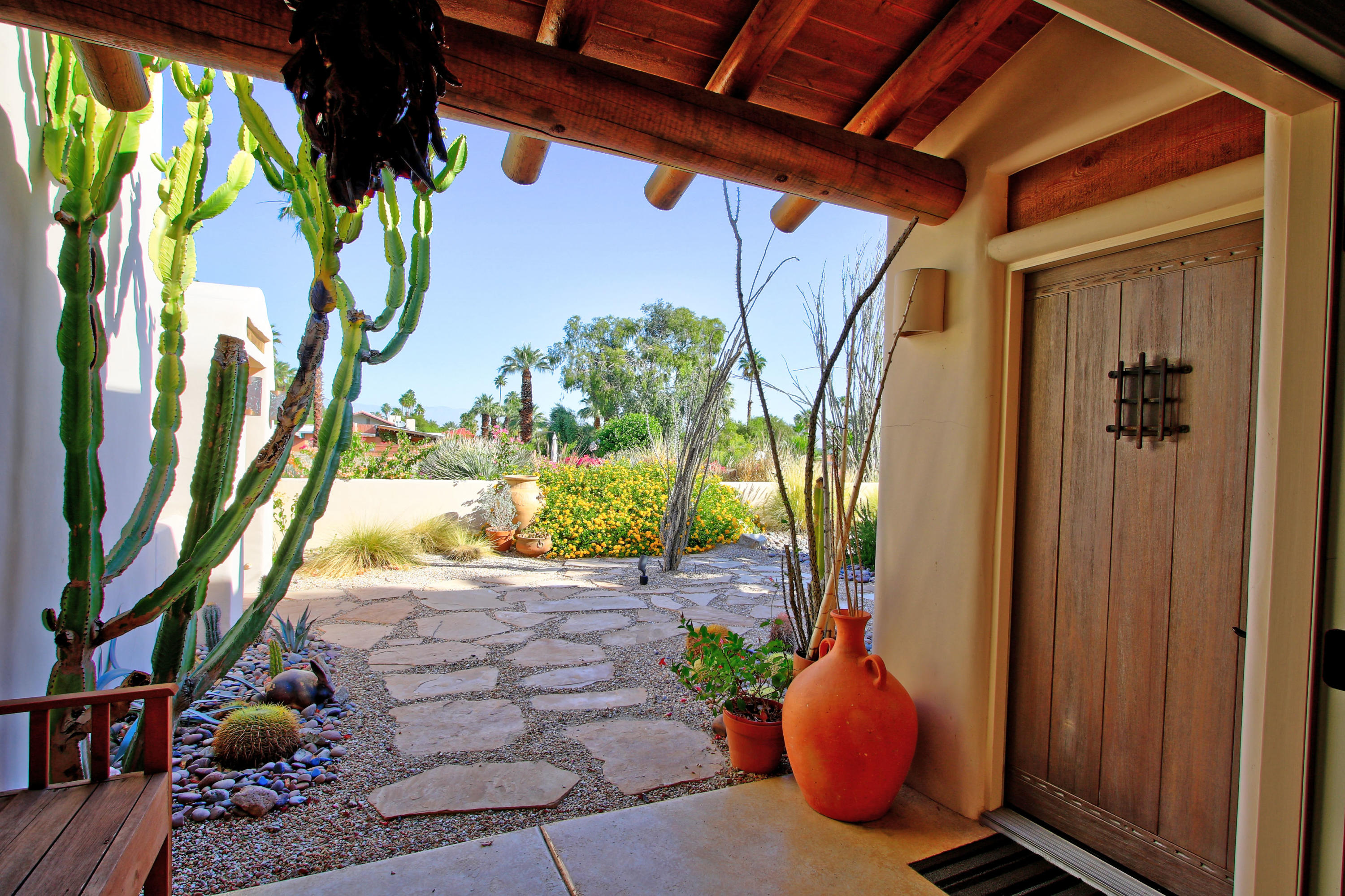 42490 Dunes View Road Rancho Mirage, CA 92270 - Photo 20 of 60 a view of a porch with furniture