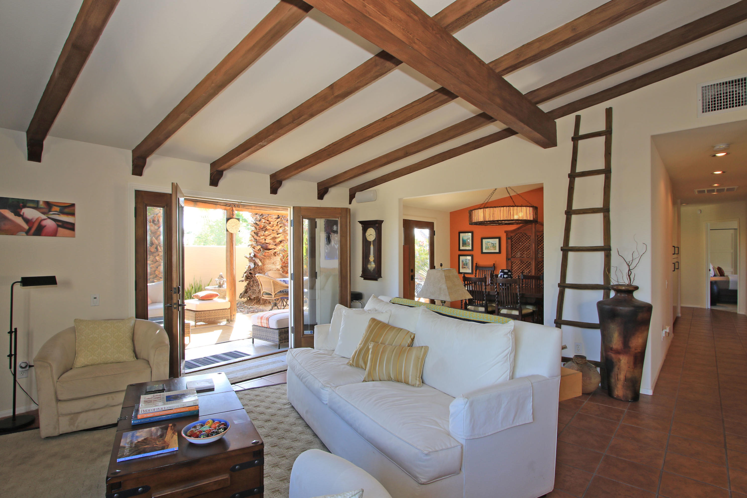 42490 Dunes View Road Rancho Mirage, CA 92270 - Photo 23 of 60 a living room with furniture and a large window