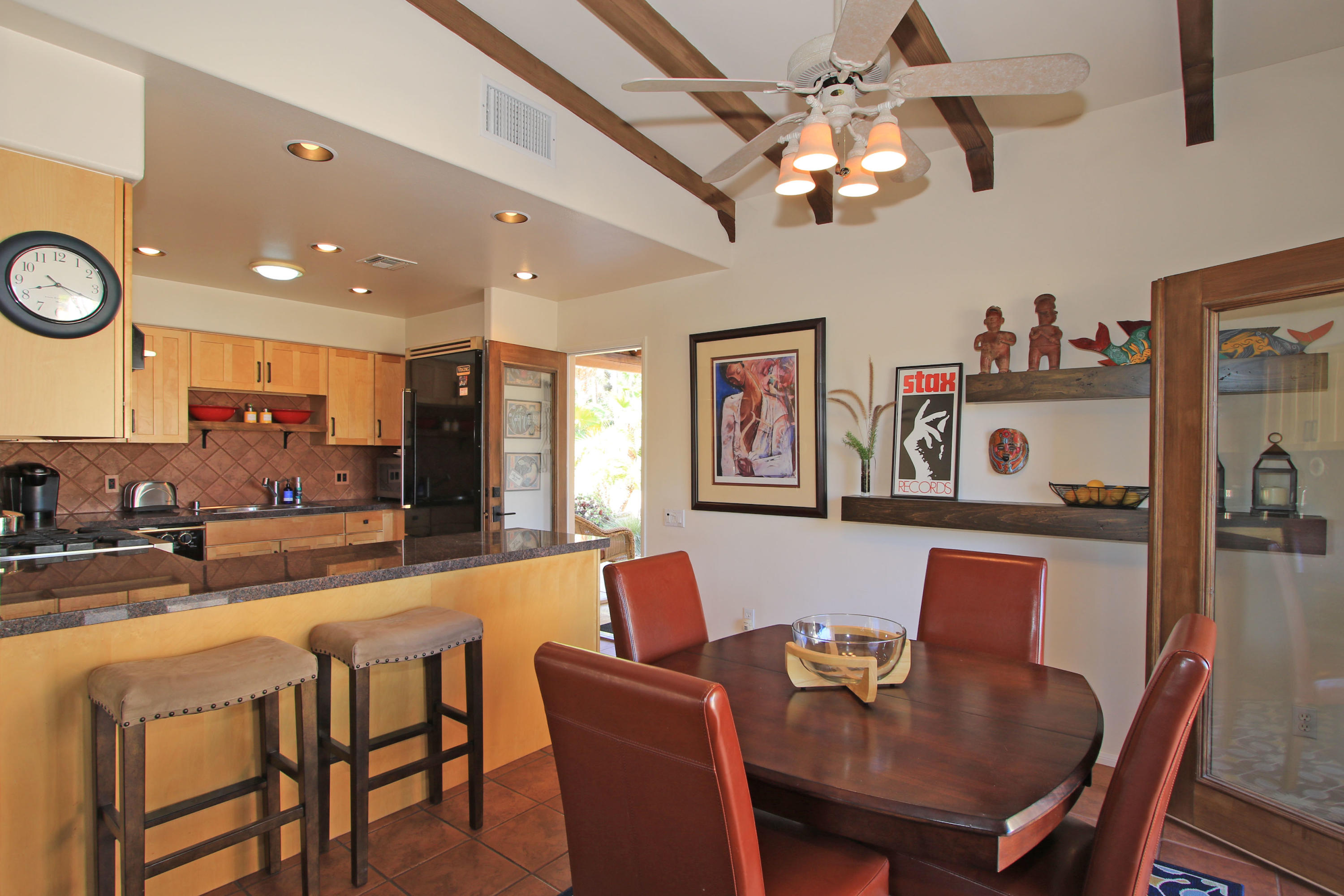 42490 Dunes View Road Rancho Mirage, CA 92270 - Photo 29 of 60 a view of a dining room with furniture and a chandelier
