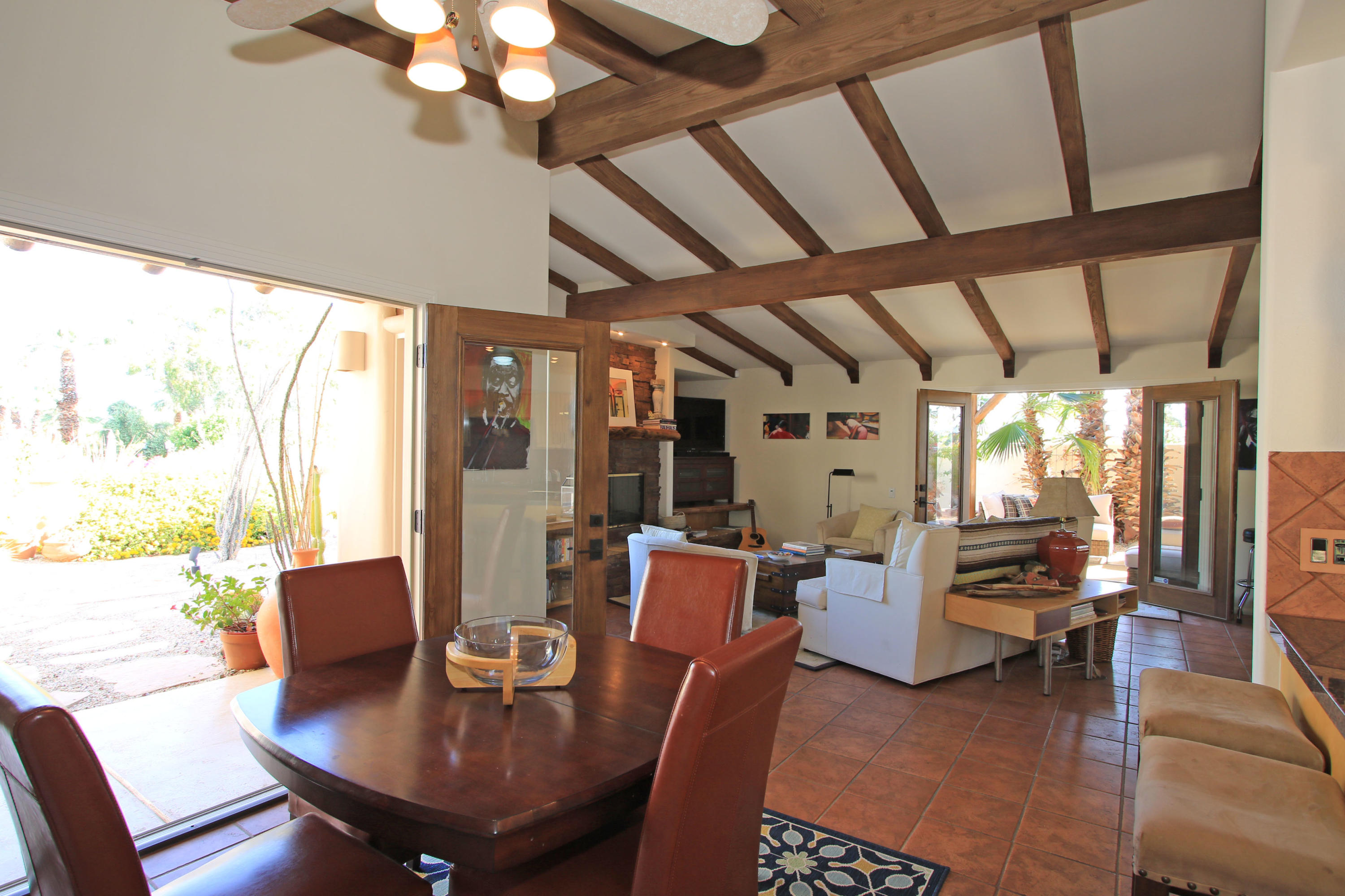 42490 Dunes View Road Rancho Mirage, CA 92270 - Photo 31 of 60 a view of a dining room with furniture wooden floor and chandelier