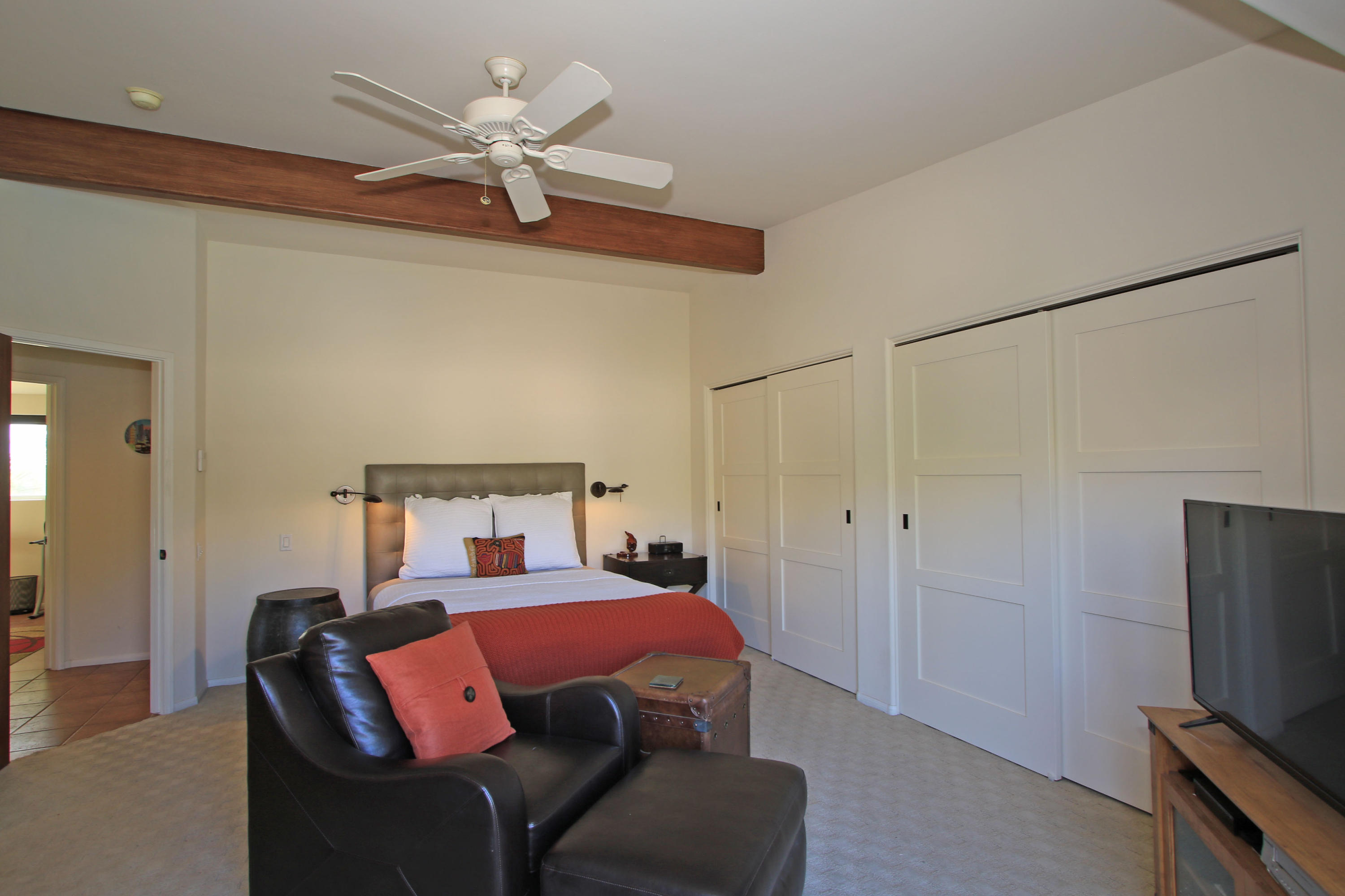 42490 Dunes View Road Rancho Mirage, CA 92270 - Photo 34 of 60 a bedroom with a bed and a ceiling fan