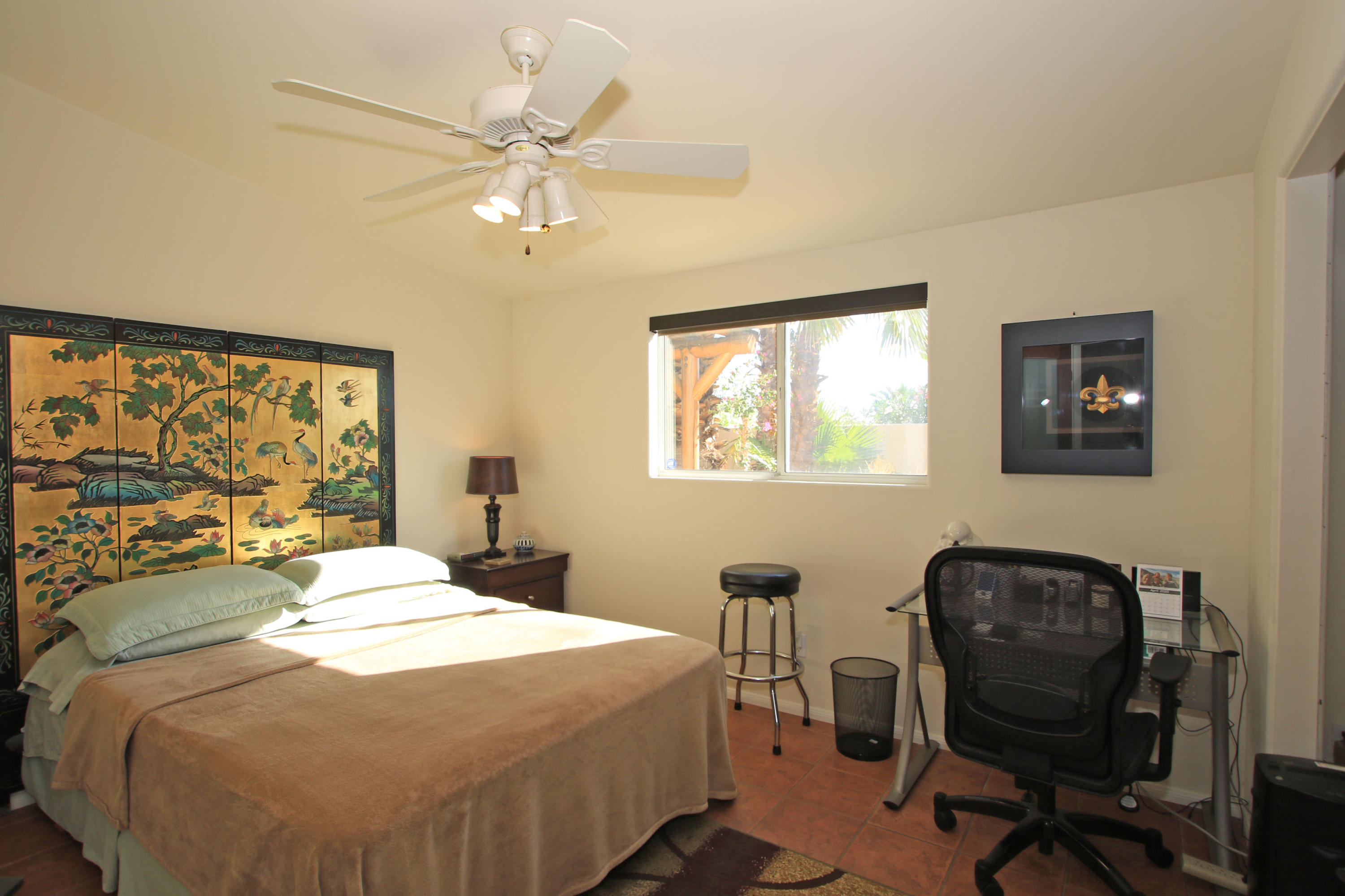 42490 Dunes View Road Rancho Mirage, CA 92270 - Photo 39 of 60 a bedroom with a large bed and a window