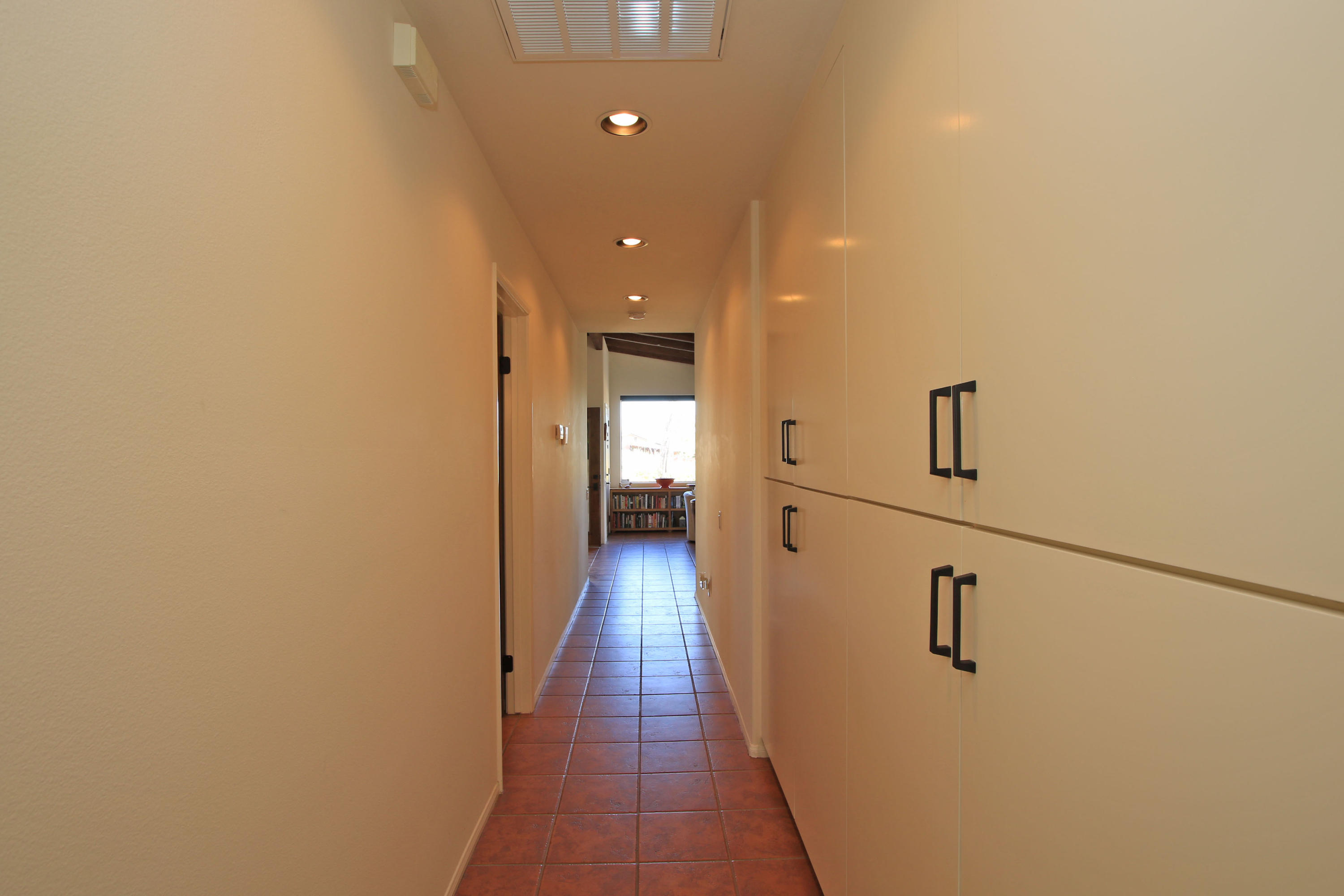 42490 Dunes View Road Rancho Mirage, CA 92270 - Photo 44 of 60 a view of a hallway with wooden floor and staircase