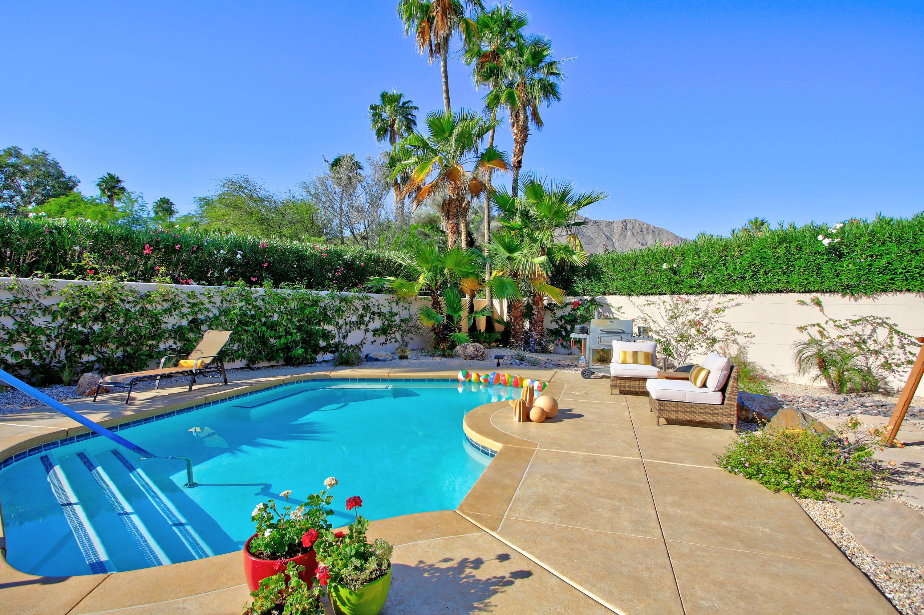 42490 Dunes View Road Rancho Mirage, CA 92270 - Photo 47 of 60 a view of a swimming pool with a patio