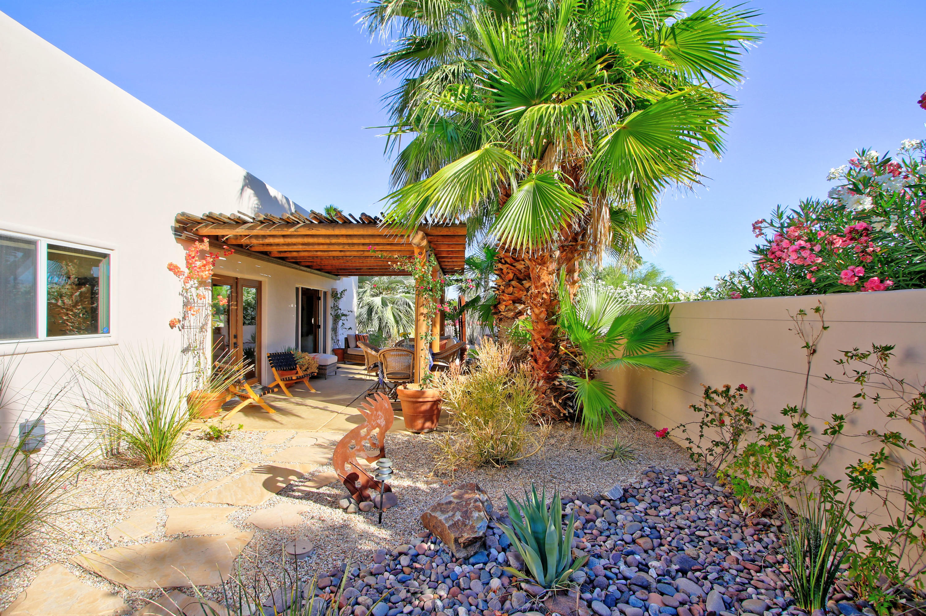 42490 Dunes View Road Rancho Mirage, CA 92270 - Photo 53 of 60 a view of a dinning table and chairs in patio