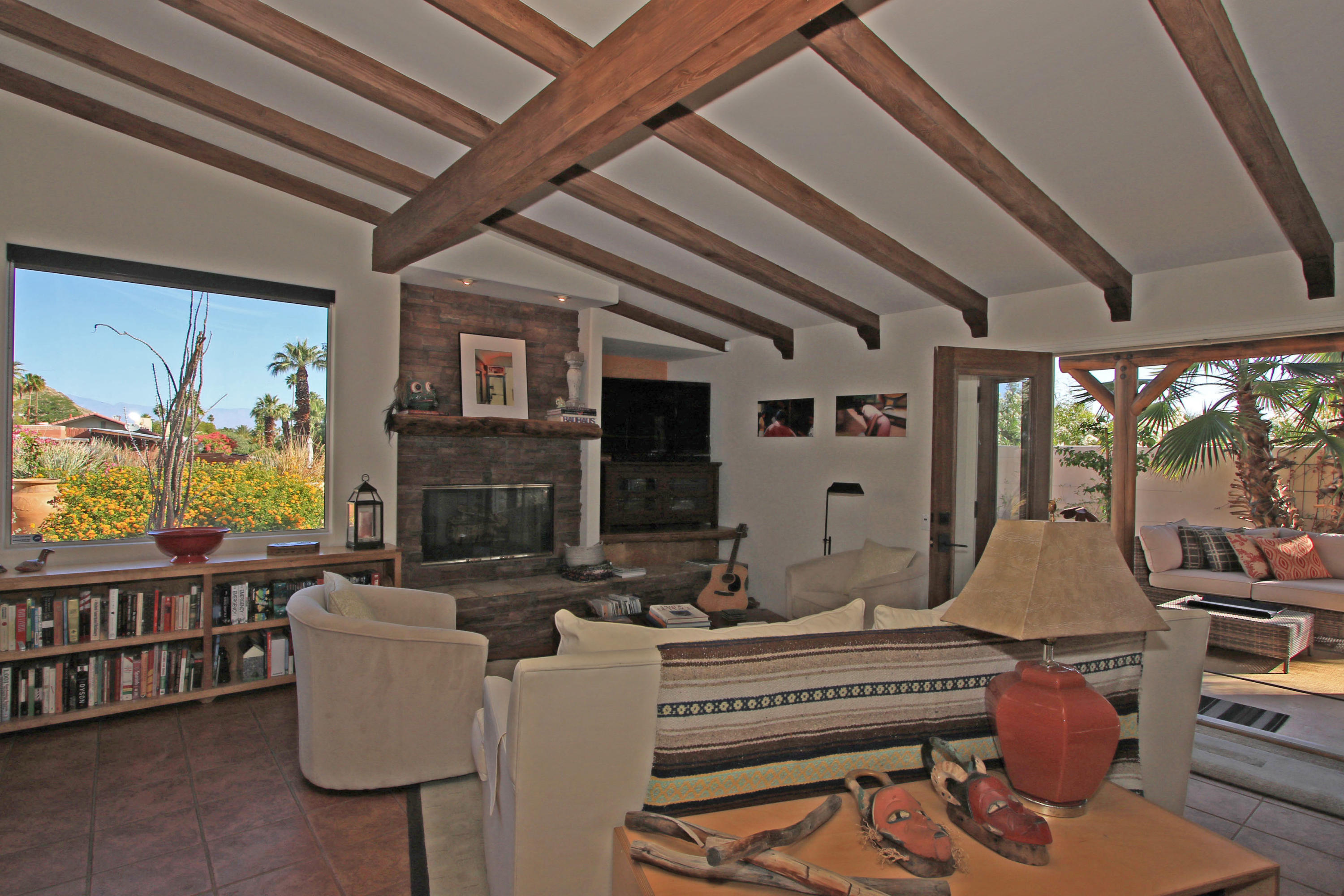 42490 Dunes View Road Rancho Mirage, CA 92270 - Photo 6 of 60 a living room with fireplace furniture and a large window