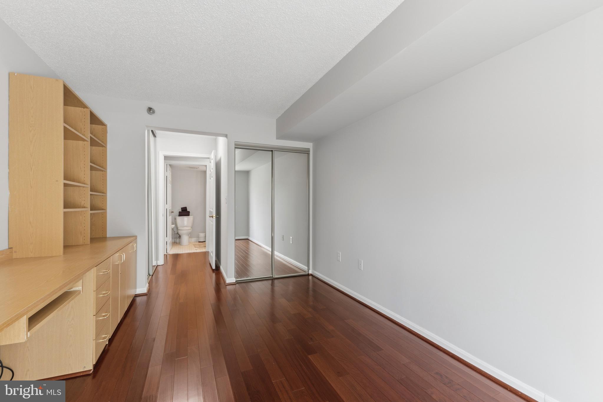 14801 Pennfield Circle, Unit 206 Silver Spring, MD 20906 - Photo 23 of 37 a view of a hallway with wooden floor