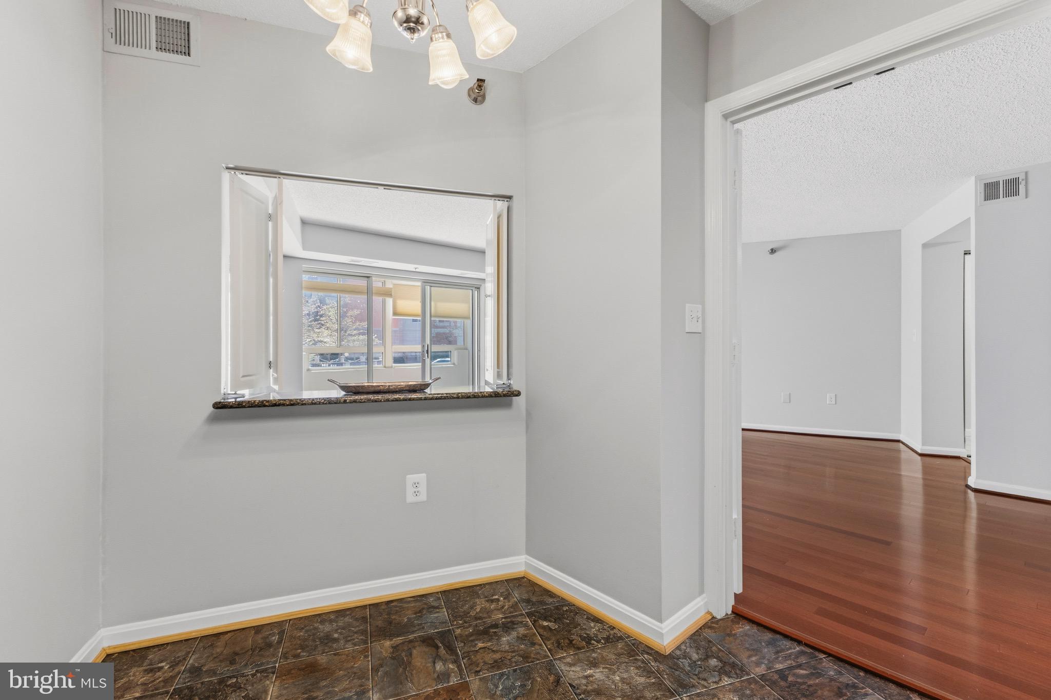 14801 Pennfield Circle, Unit 206 Silver Spring, MD 20906 - Photo 5 of 37 a view of an entryway with wooden floor