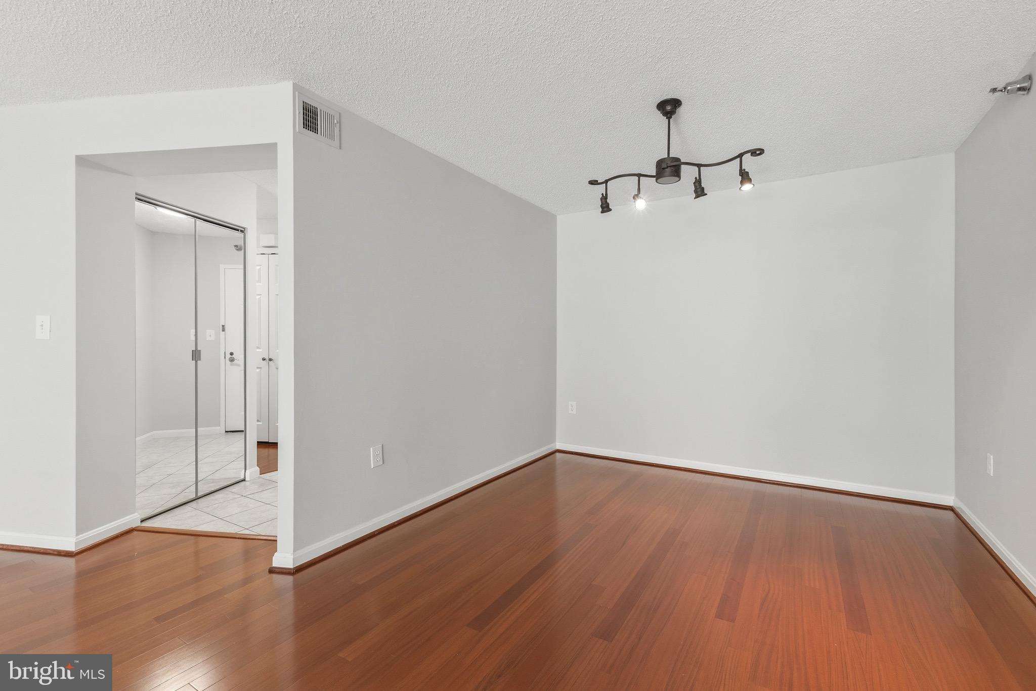 14801 Pennfield Circle, Unit 206 Silver Spring, MD 20906 - Photo 9 of 37 a view of a room with wooden floor