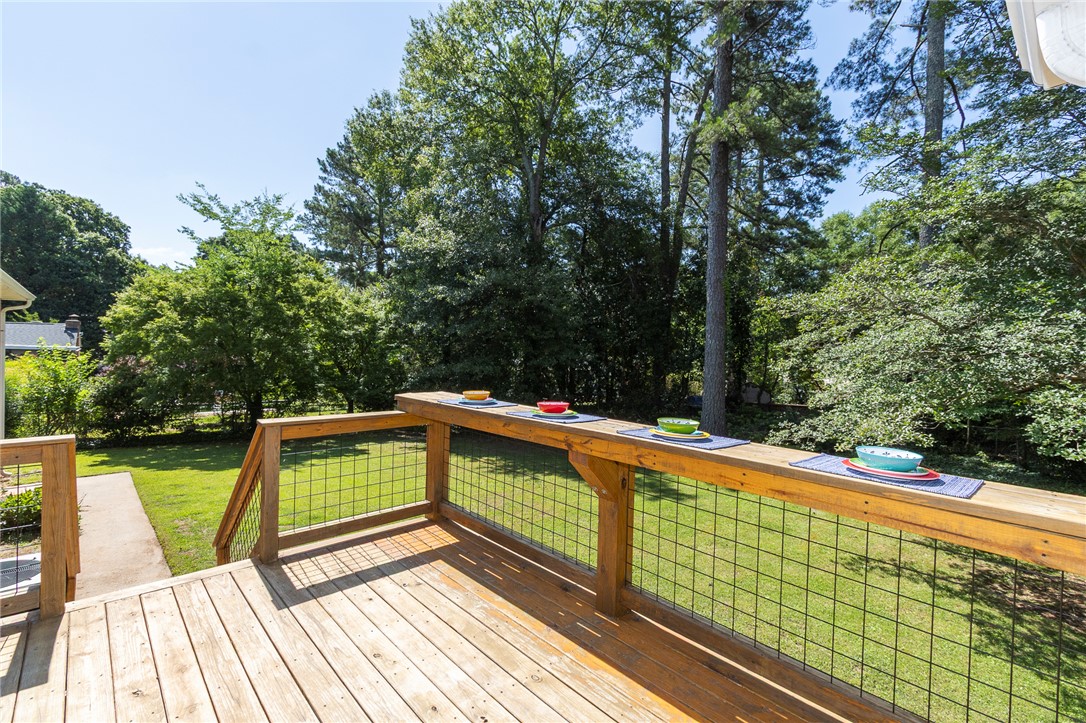 207 Laurel Ridge Road Anderson, SC 29621 - Photo 40 of 50 A spacious wooden deck with wire railings provides an ideal setting for outdoor dining and entertaining.