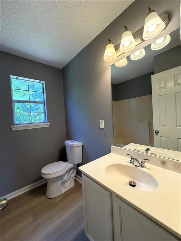 2205 Springer Walk Lawrenceville, GA 30043 - Photo 21 of 26 a bathroom with a sink and a mirror