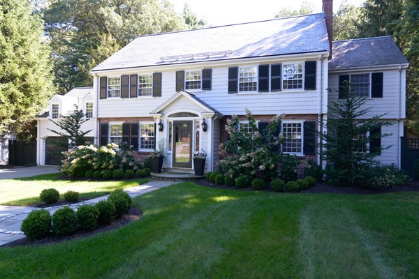 14 Old Town Road Wellesley, MA 02481 - Photo 1 of 17 a front view of a house with a yard and potted plants