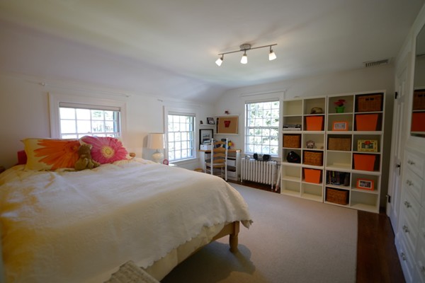 14 Old Town Road Wellesley, MA 02481 - Photo 15 of 17 a spacious bedroom with a bed and a bookshelf