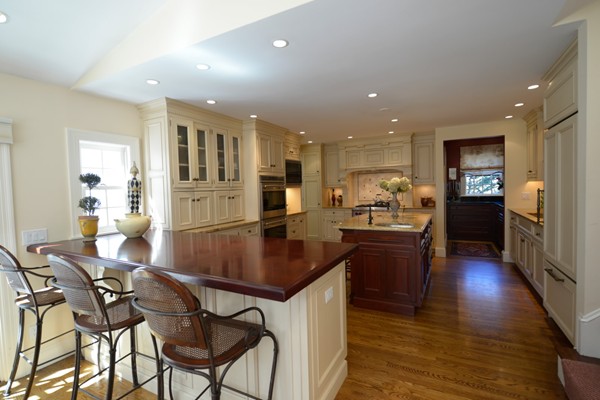 14 Old Town Road Wellesley, MA 02481 - Photo 6 of 17 a kitchen with stainless steel appliances granite countertop table chairs stove and refrigerator