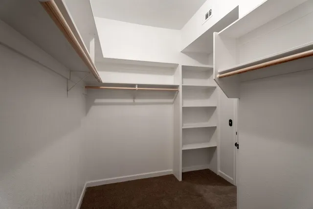a view of an empty walk in closet
