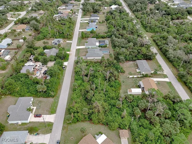 an aerial view of house with yard