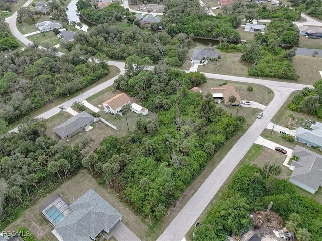 an aerial view of house with yard