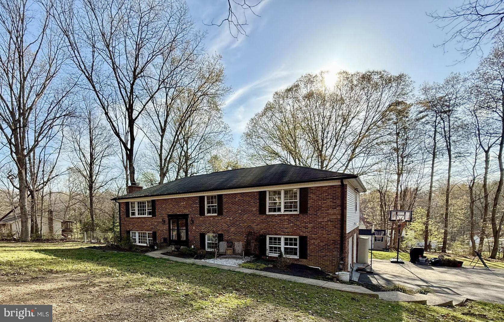 a view of house with yard