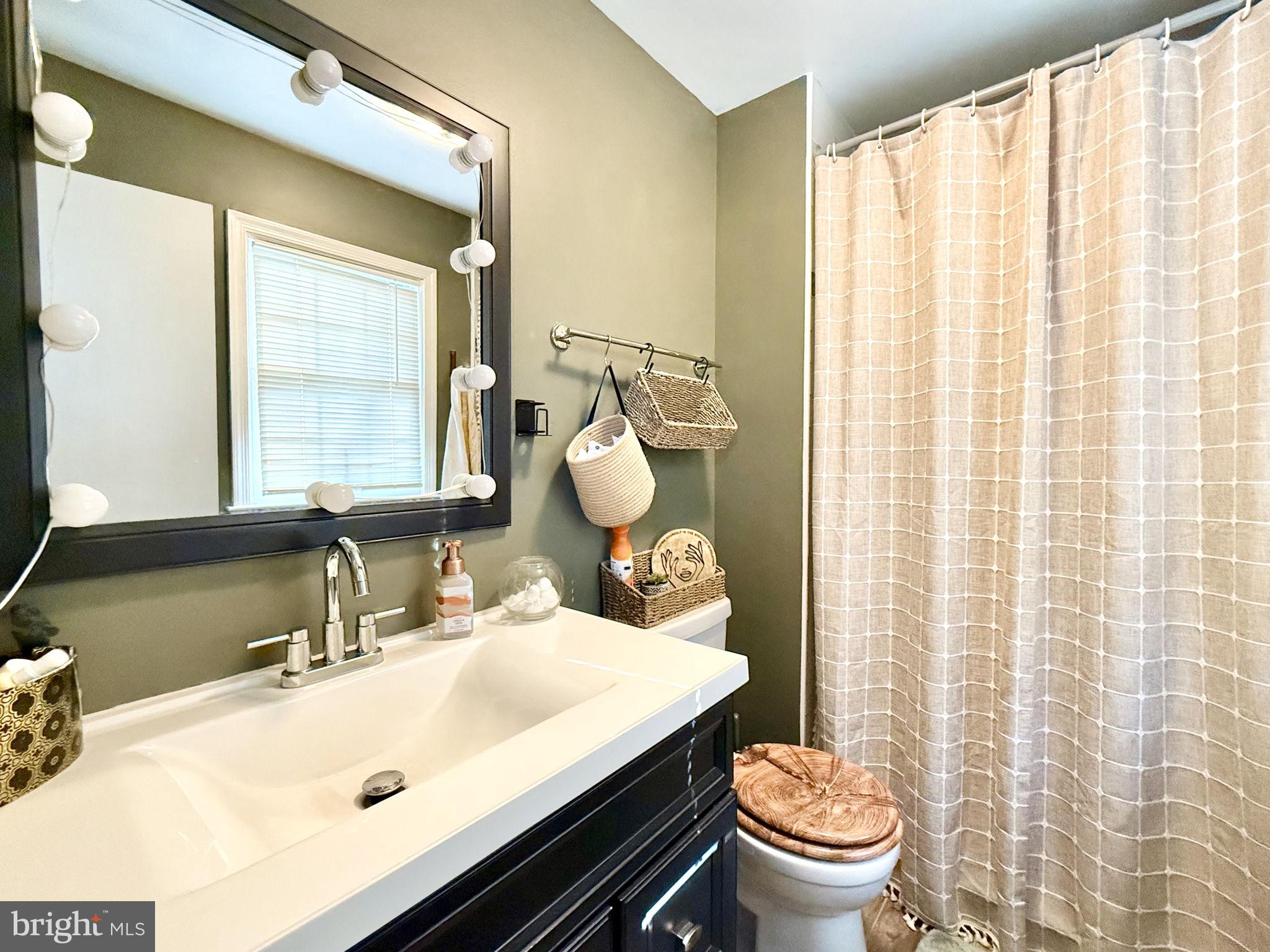 8 Rolling Road Stafford, VA 22556 - Photo 13 of 22 a bathroom with a sink toilet and mirror