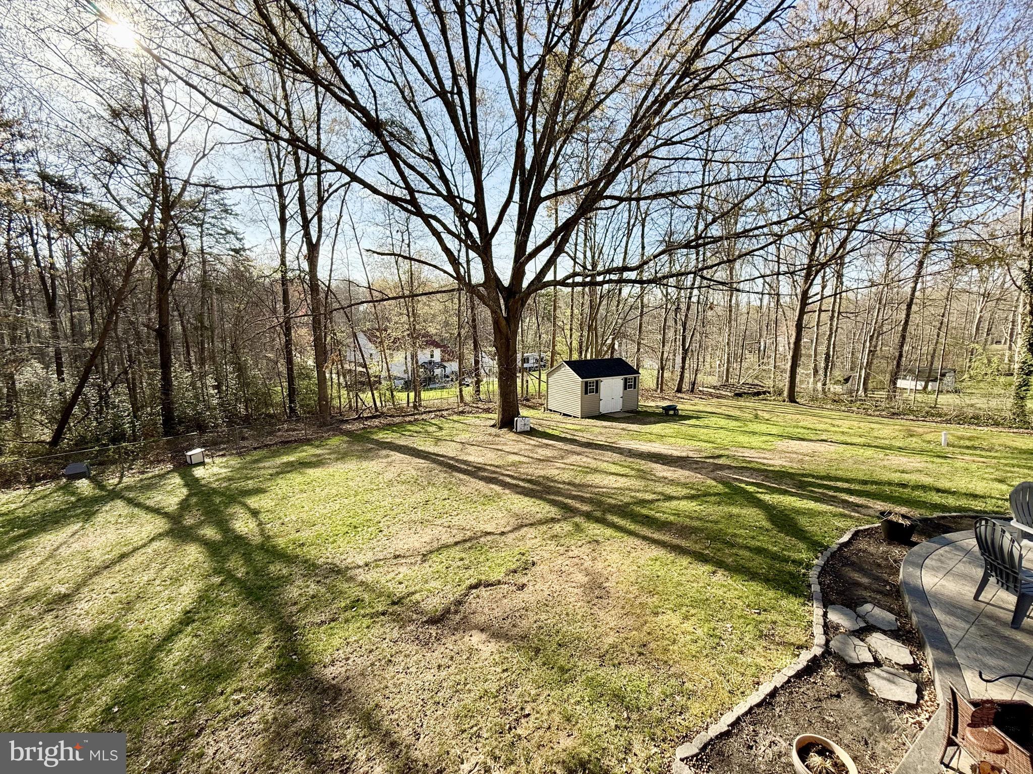 8 Rolling Road Stafford, VA 22556 - Photo 20 of 22 a swimming pool with outdoor seating and trees