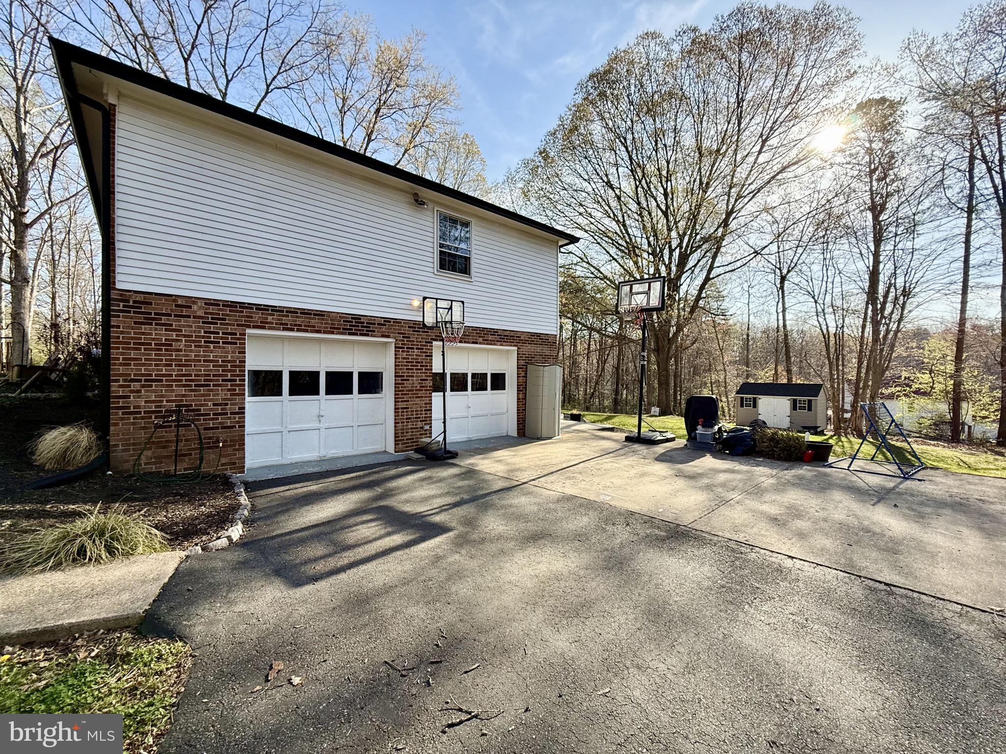 8 Rolling Road Stafford, VA 22556 - Photo 3 of 22 a white house that has a tree on the side of it