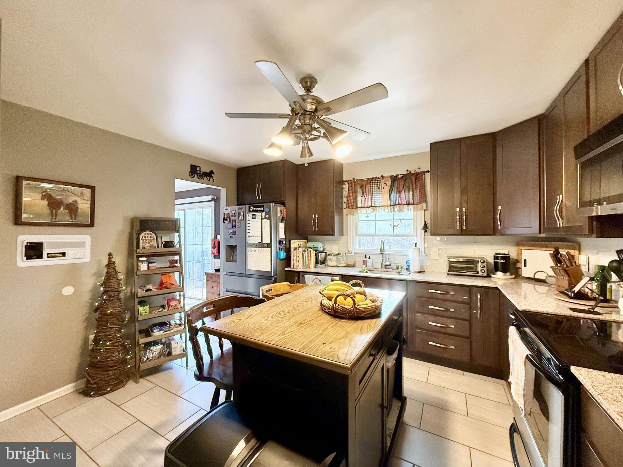 8 Rolling Road Stafford, VA 22556 - Photo 8 of 22 a kitchen with a stove a refrigerator and a sink