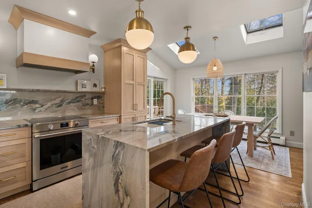 a kitchen with a stove a sink and a refrigerator