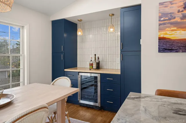 a bedroom with a sink and a mirror