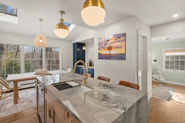 a view of a kitchen area kitchen island furniture and a chandelier